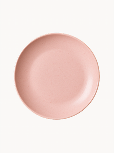 Widok z góry na matowy, ceramiczny talerz w kolorze pastelowego różu.